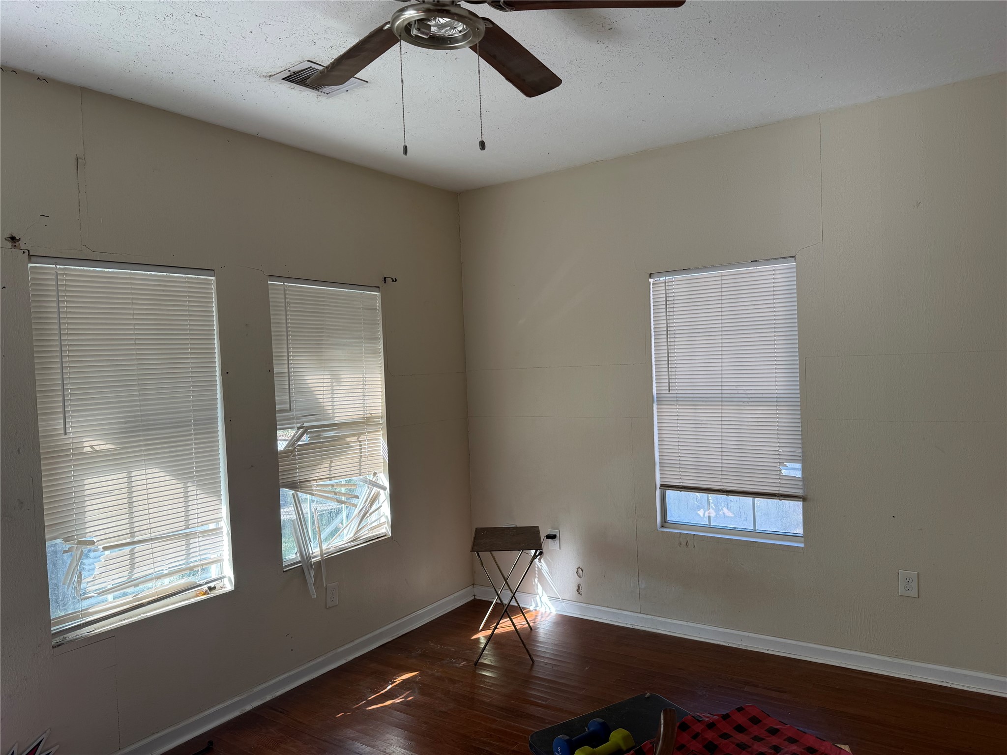185 Woodvale Street Houston, TX 77012 - Photo 9 of 9 a room with window and wooden floor