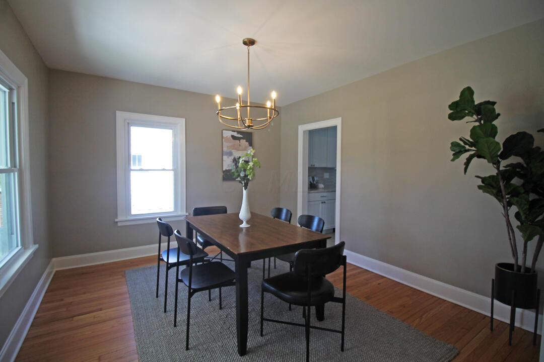 108 Garden Road Columbus, OH 43214 - Photo 4 of 20 Large formal dining room with refinished oak hardwood floors, new light fixture and neutral decor