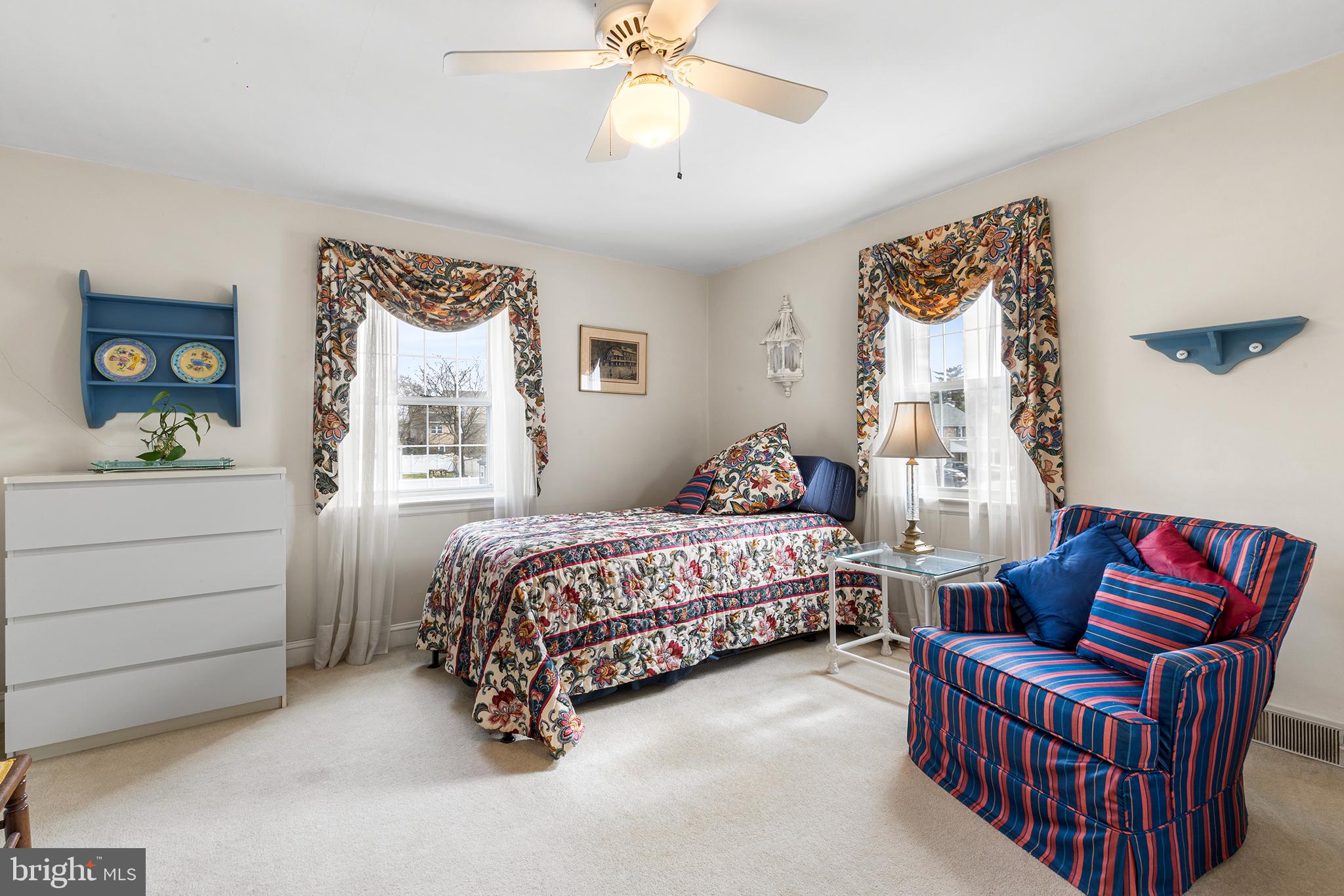 325 Wyndmoor Road Springfield, PA 19064 - Photo 19 of 45 a bedroom with a bed and a chandelier