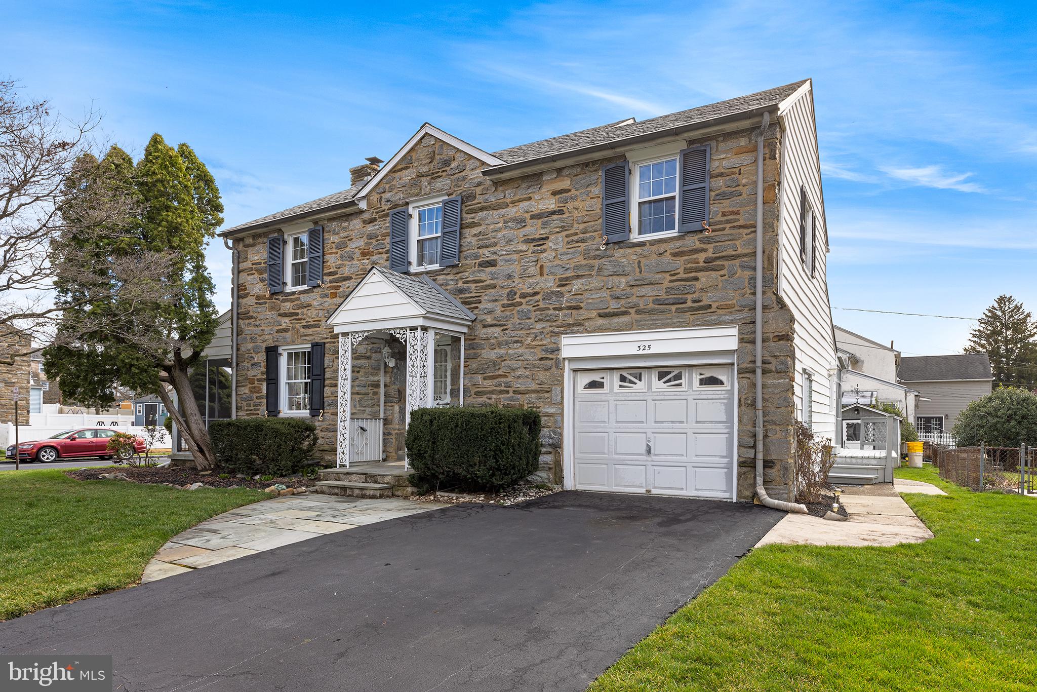 325 Wyndmoor Road Springfield, PA 19064 - Photo 2 of 45 a front view of a house with a yard and garage