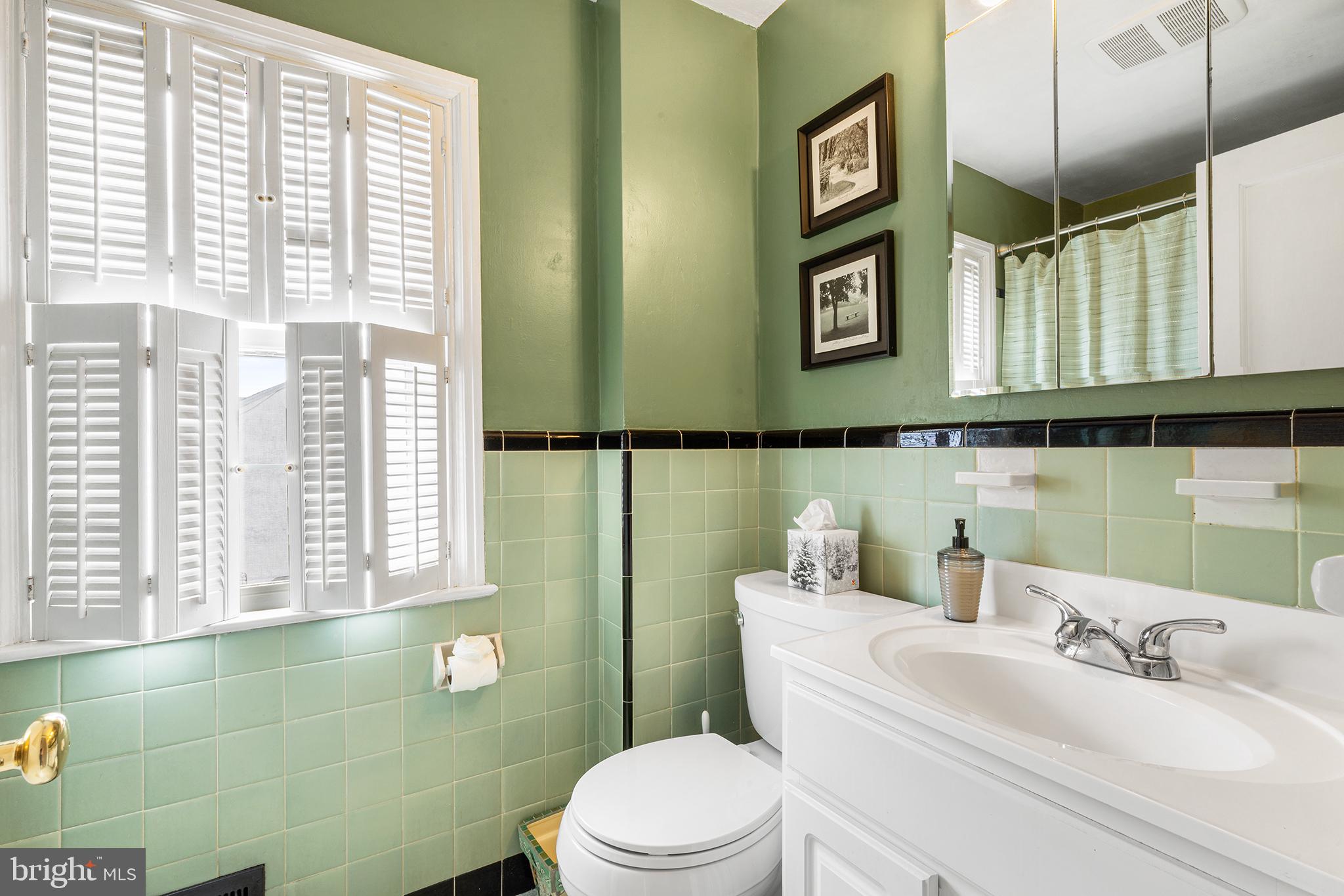 325 Wyndmoor Road Springfield, PA 19064 - Photo 25 of 45 a bathroom with a sink mirror next to a window