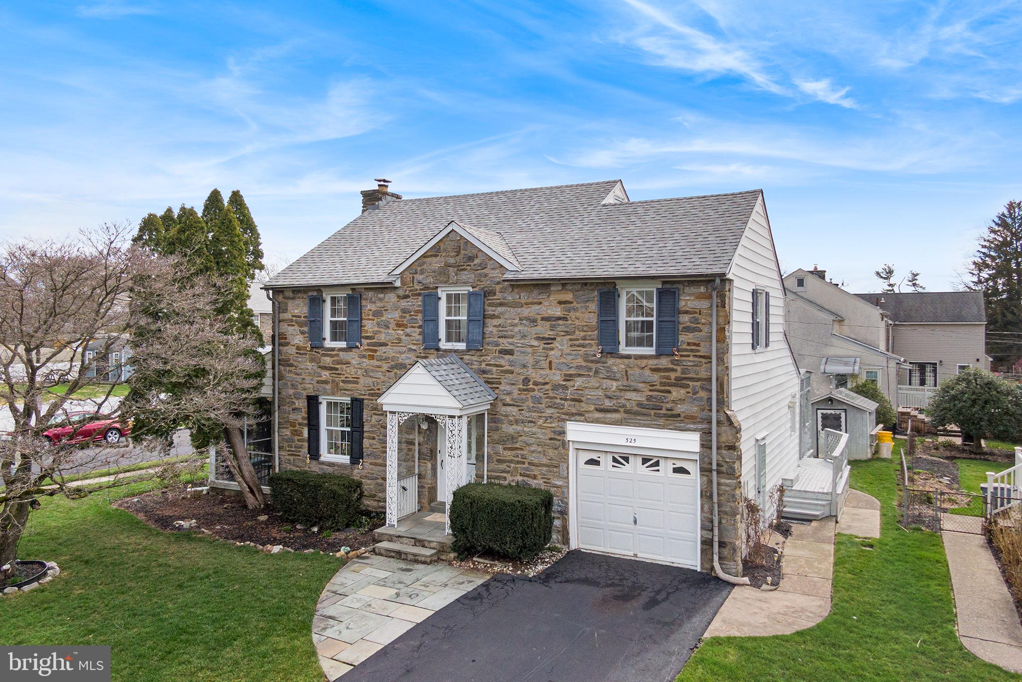 325 Wyndmoor Road Springfield, PA 19064 - Photo 3 of 45 a front view of a house with a garden