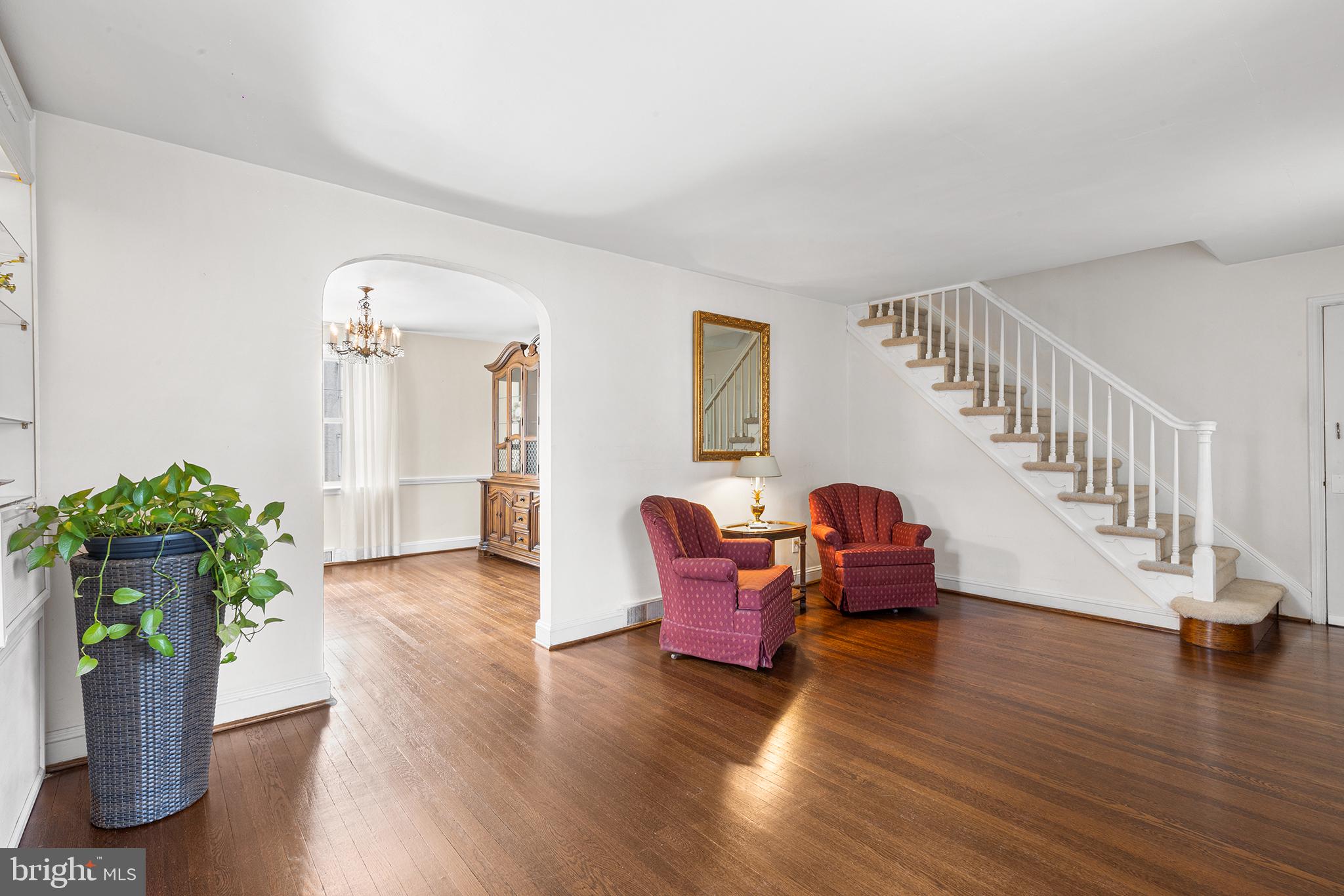 325 Wyndmoor Road Springfield, PA 19064 - Photo 5 of 45 a dining room with furniture potted plants and wooden floor