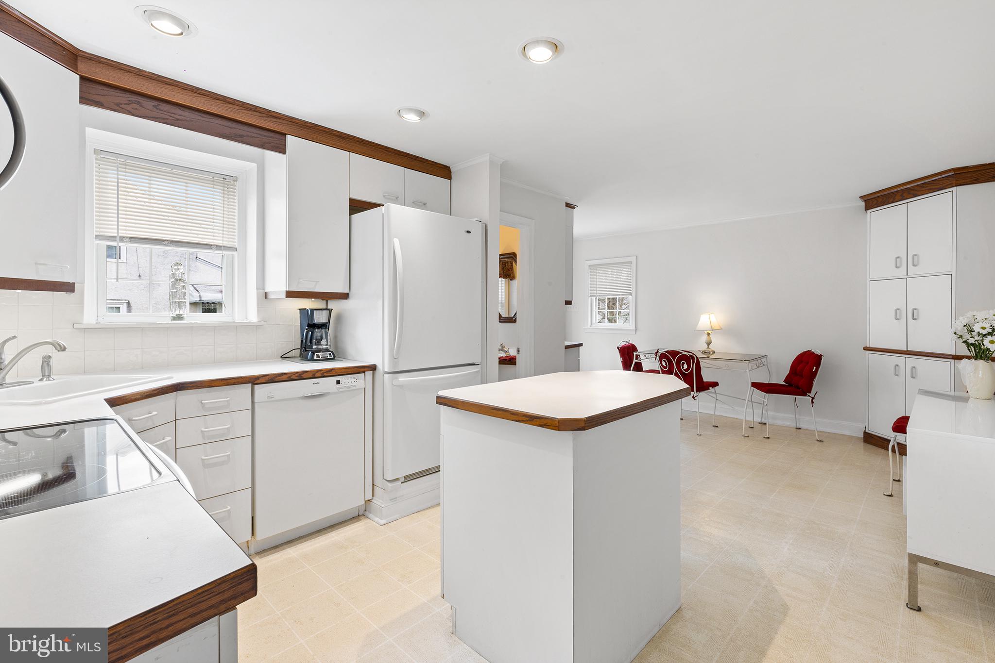 325 Wyndmoor Road Springfield, PA 19064 - Photo 8 of 45 a kitchen with a sink stove and refrigerator