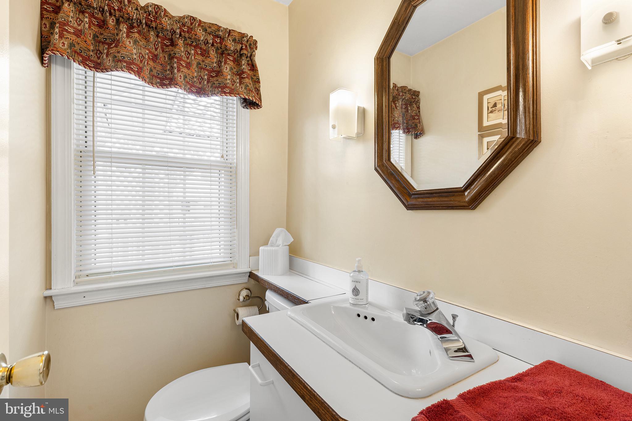 325 Wyndmoor Road Springfield, PA 19064 - Photo 10 of 45 a bathroom with a sink and a mirror