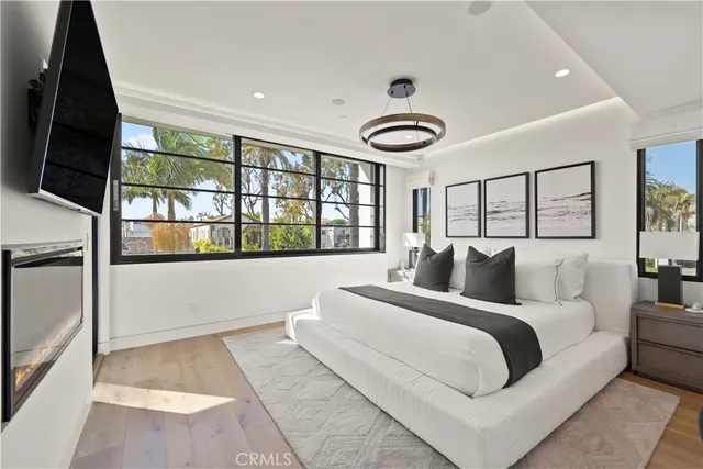 a bedroom with a large bed and a large window