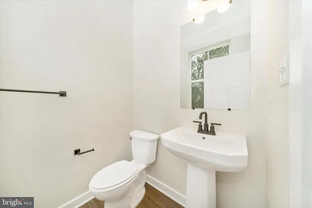 a bathroom with a double vanity sink mirror and