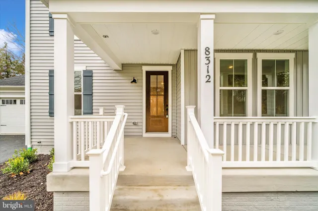 a front view of a house with large windows