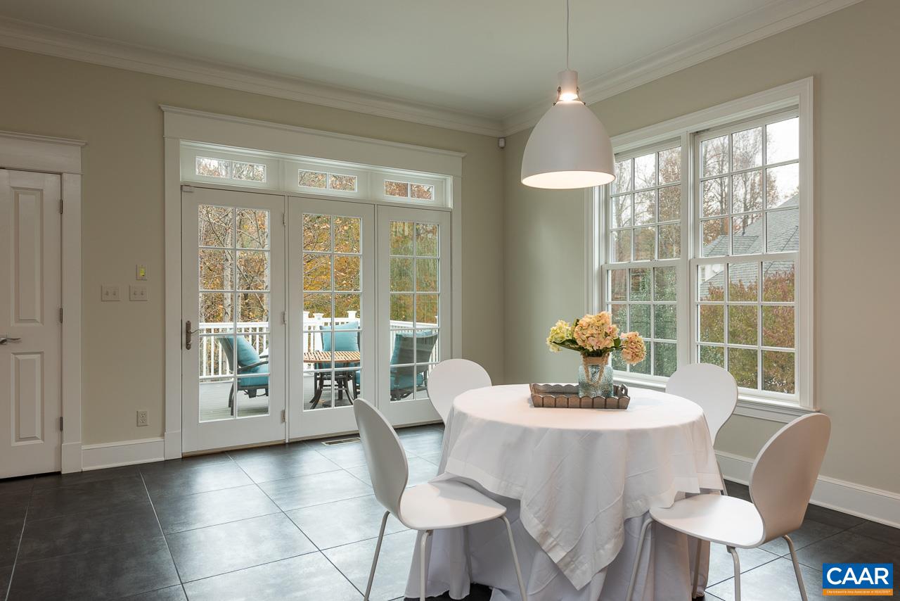 3104 Darby Road Keswick, VA 22947 - Photo 16 of 43 a view of a dining room with furniture window and outside view