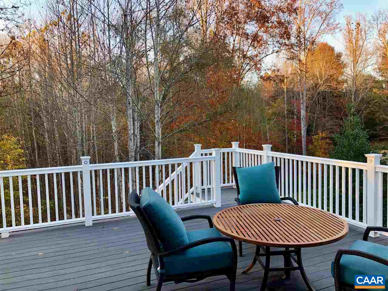 3104 Darby Road Keswick, VA 22947 - Photo 29 of 43 a view of a chair and table on the deck