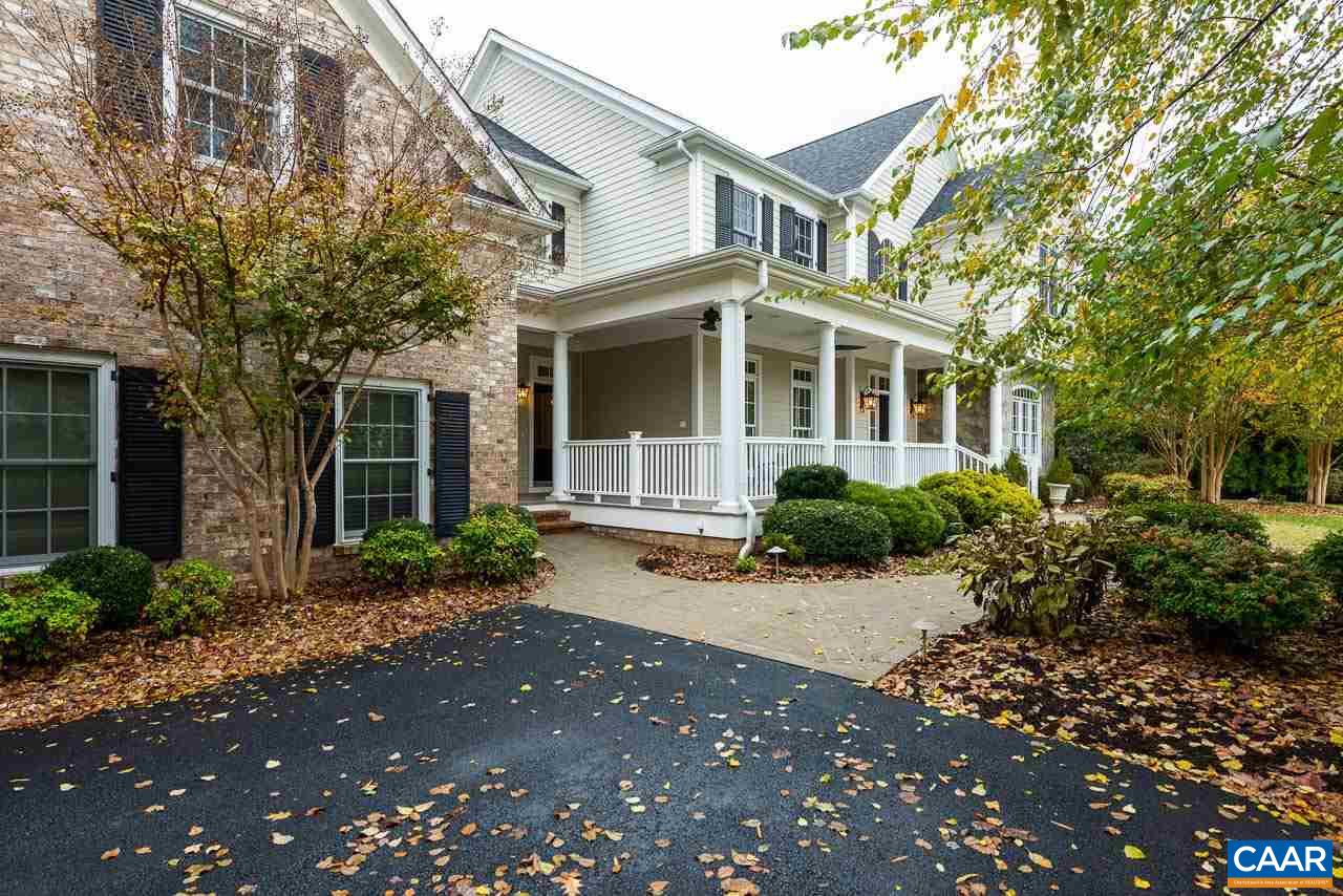 3104 Darby Road Keswick, VA 22947 - Photo 34 of 43 a front view of a house with a yard and potted plants