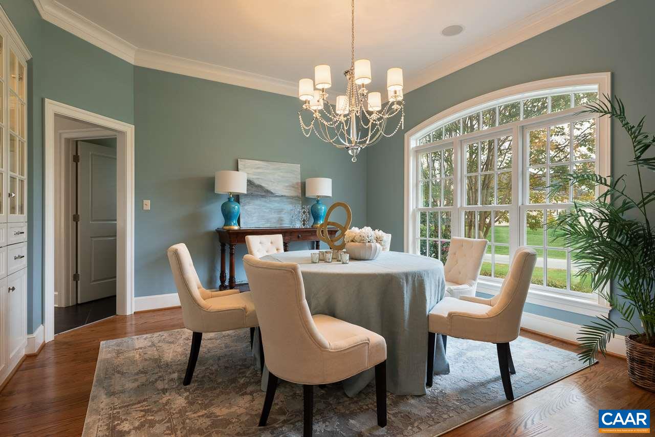 3104 Darby Road Keswick, VA 22947 - Photo 5 of 43 a view of a dining room with furniture a chandelier and wooden floor