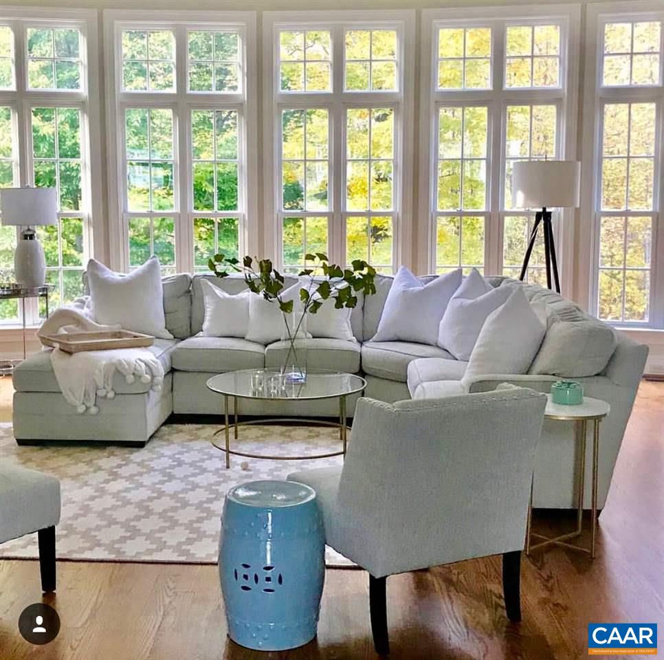 3104 Darby Road Keswick, VA 22947 - Photo 10 of 43 a living room with furniture and floor to ceiling windows