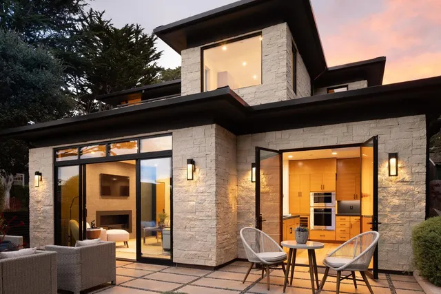 a view of balcony with furniture and large windows