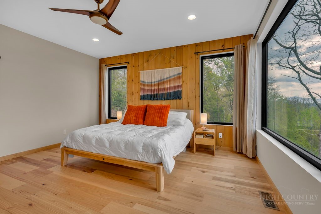 799 Milton Brown Heirs Road Boone, NC 28607 - Photo 24 of 49 a bedroom with a bed and window