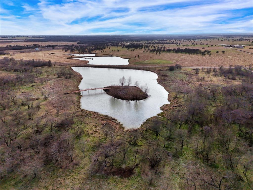 9784 County Line Road South Mount Calm, TX 76673 - Photo 2 of 15 a view of a lake with outdoor space