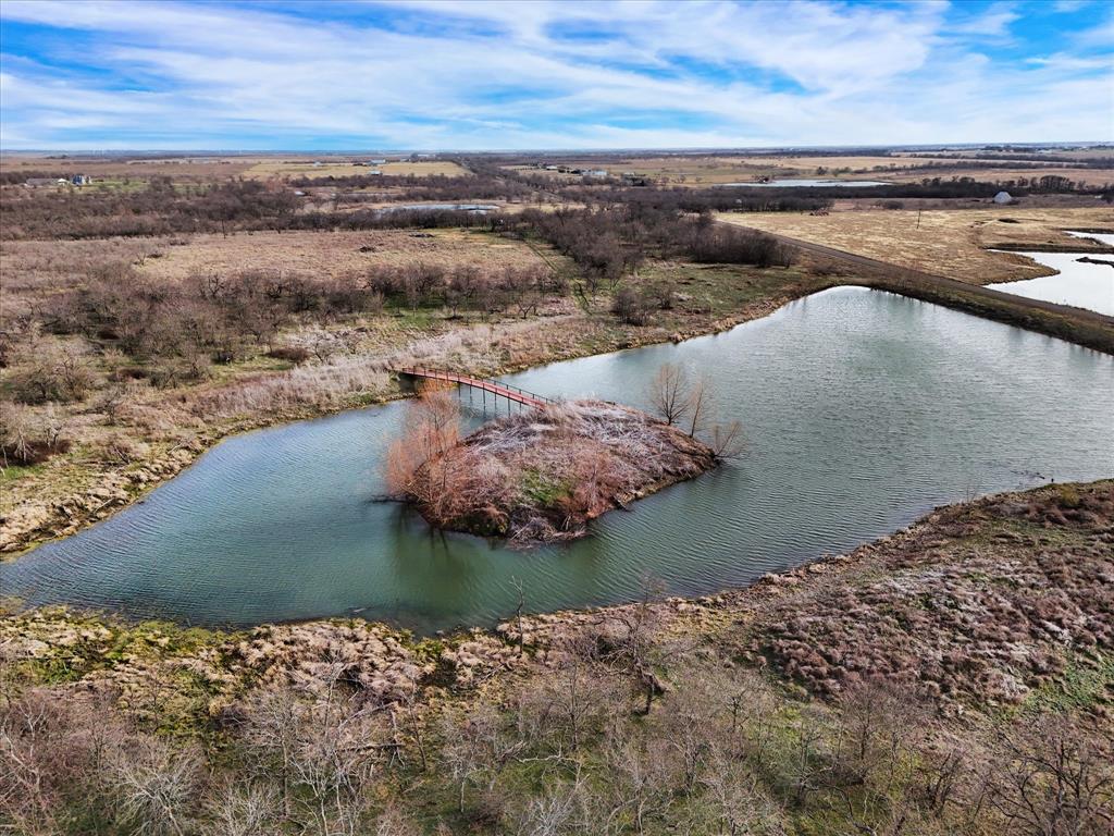 9784 County Line Road South Mount Calm, TX 76673 - Photo 6 of 15 a view of a lake from a yard