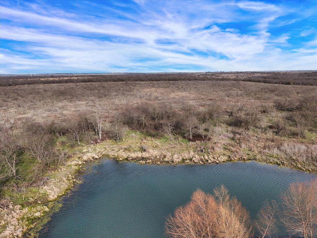 9784 County Line Road South Mount Calm, TX 76673 - Photo 7 of 15 a view of a lake with a mountain