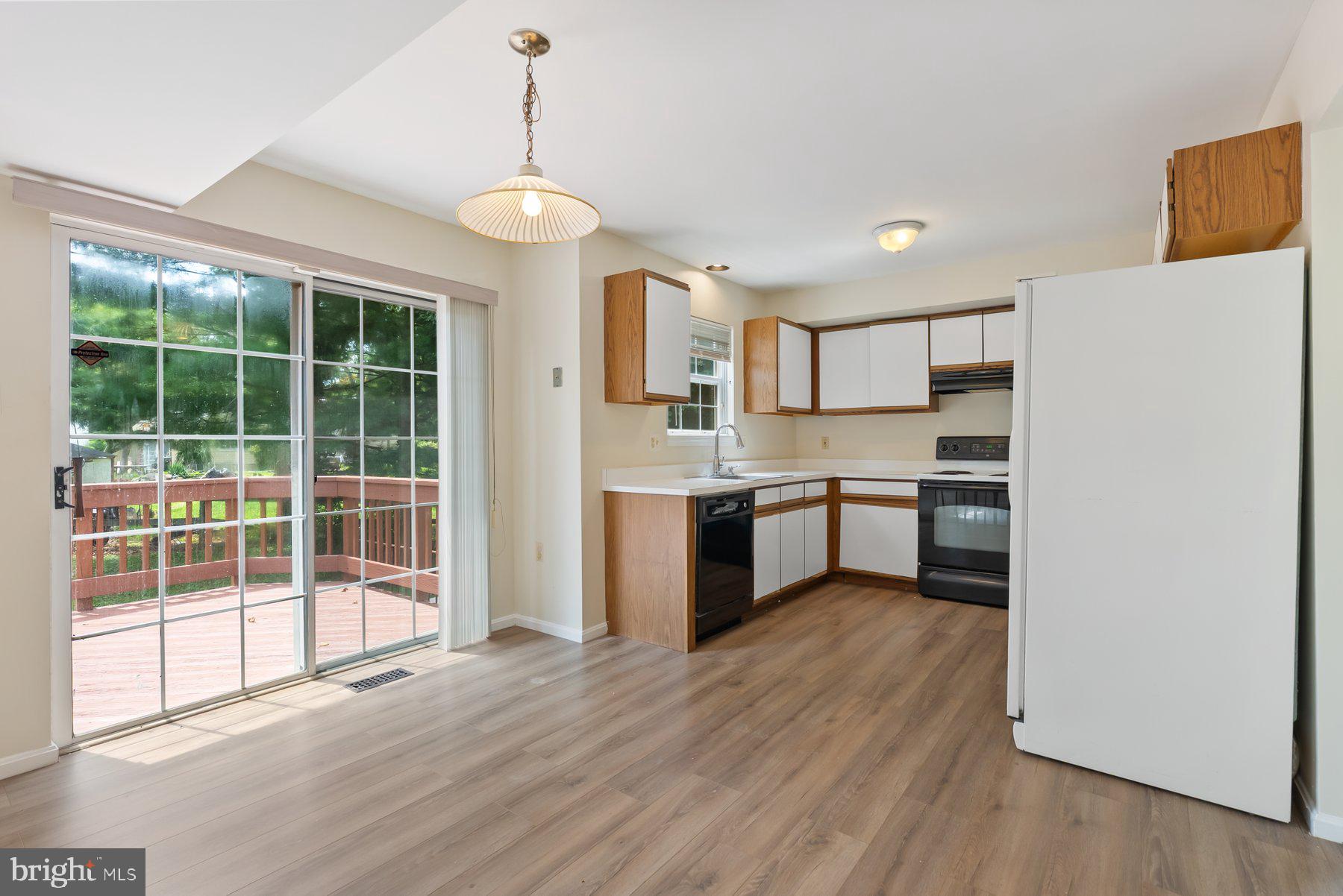 13 Bellinger Court Reisterstown, MD 21136 - Photo 12 of 37 a view of kitchen with wooden floor and electronic appliances