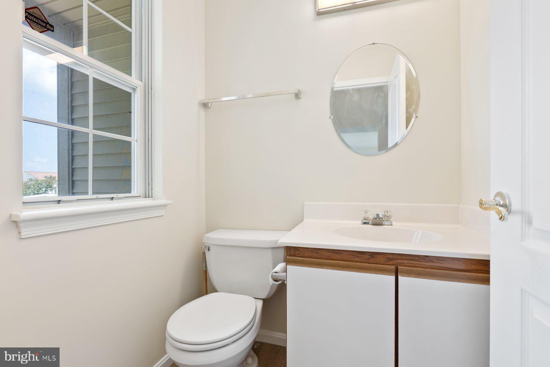 13 Bellinger Court Reisterstown, MD 21136 - Photo 16 of 37 a bathroom with a sink a toilet and a mirror