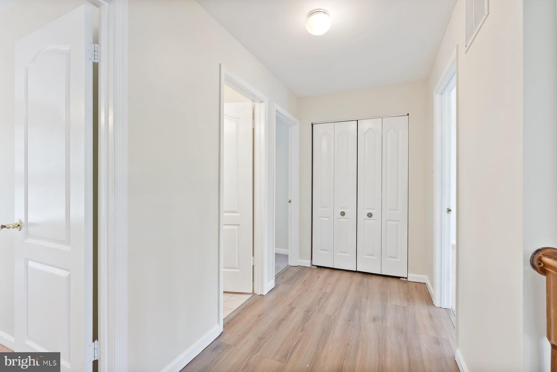 13 Bellinger Court Reisterstown, MD 21136 - Photo 17 of 37 a view of a hallway with wooden floor