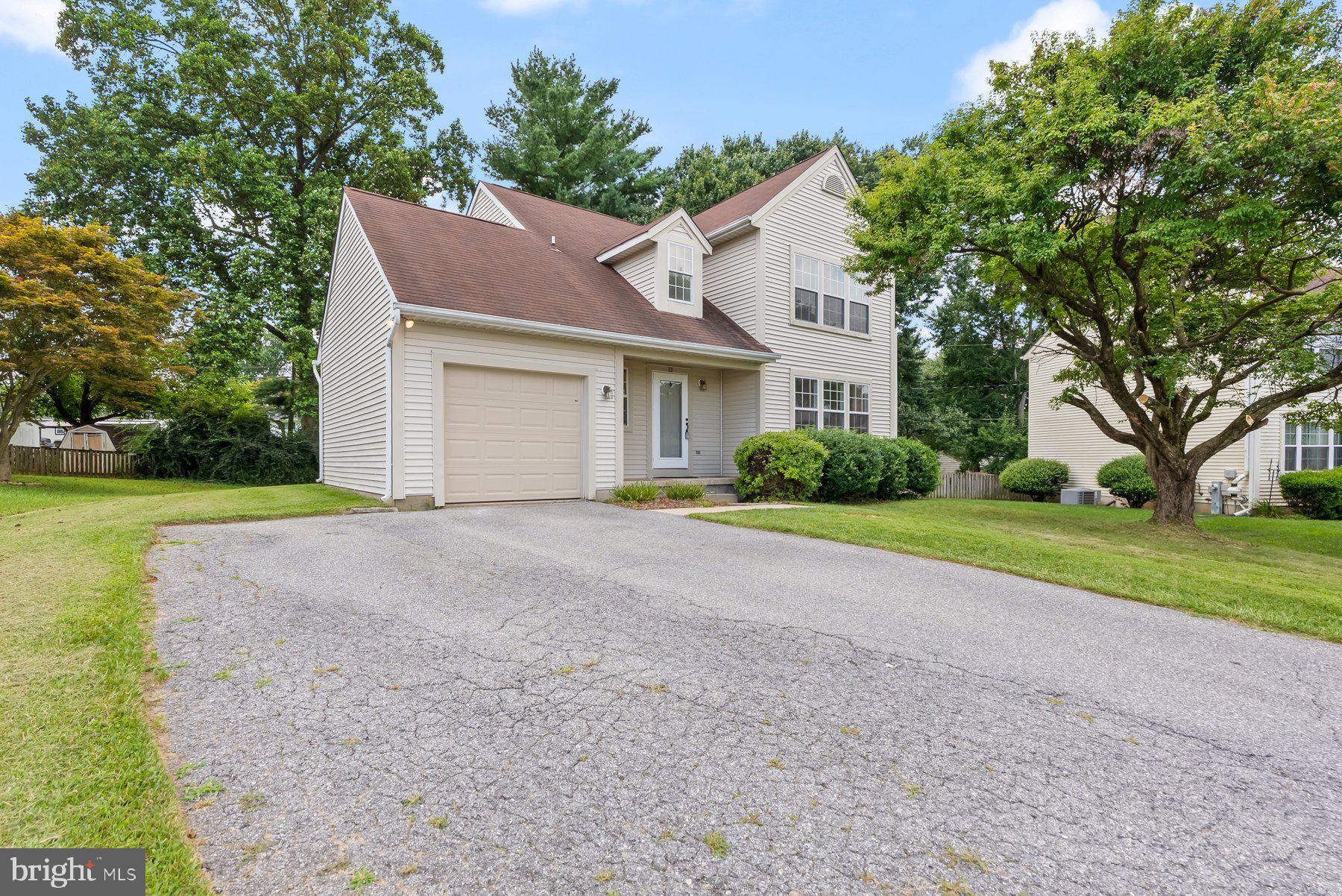 13 Bellinger Court Reisterstown, MD 21136 - Photo 2 of 37 a front view of house with yard and green space