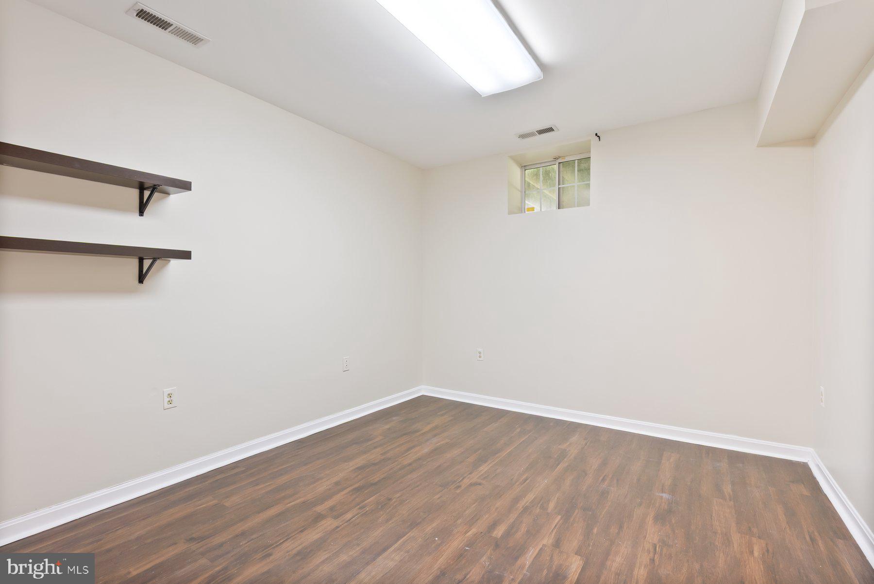 13 Bellinger Court Reisterstown, MD 21136 - Photo 28 of 37 wooden floor in an empty room