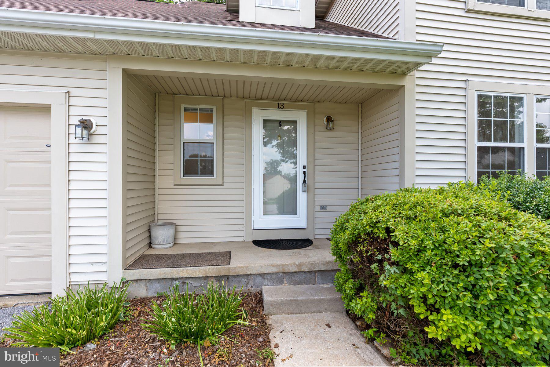 13 Bellinger Court Reisterstown, MD 21136 - Photo 4 of 37 a front view of a house with garden