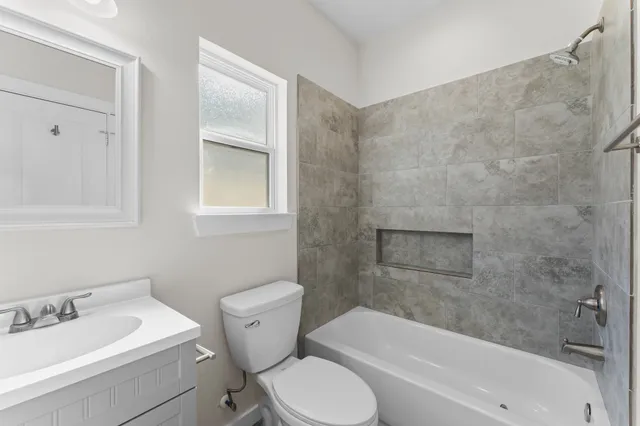a bathroom with a toilet sink and bathtub
