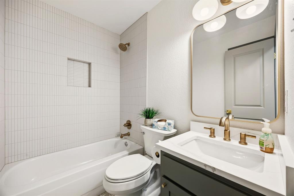 617 Reed Street Roanoke, TX 76262 - Photo 17 of 35 a bathroom with a sink toilet and shower
