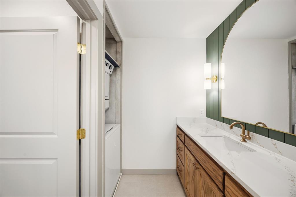617 Reed Street Roanoke, TX 76262 - Photo 23 of 35 a bathroom with a double vanity sink and mirror