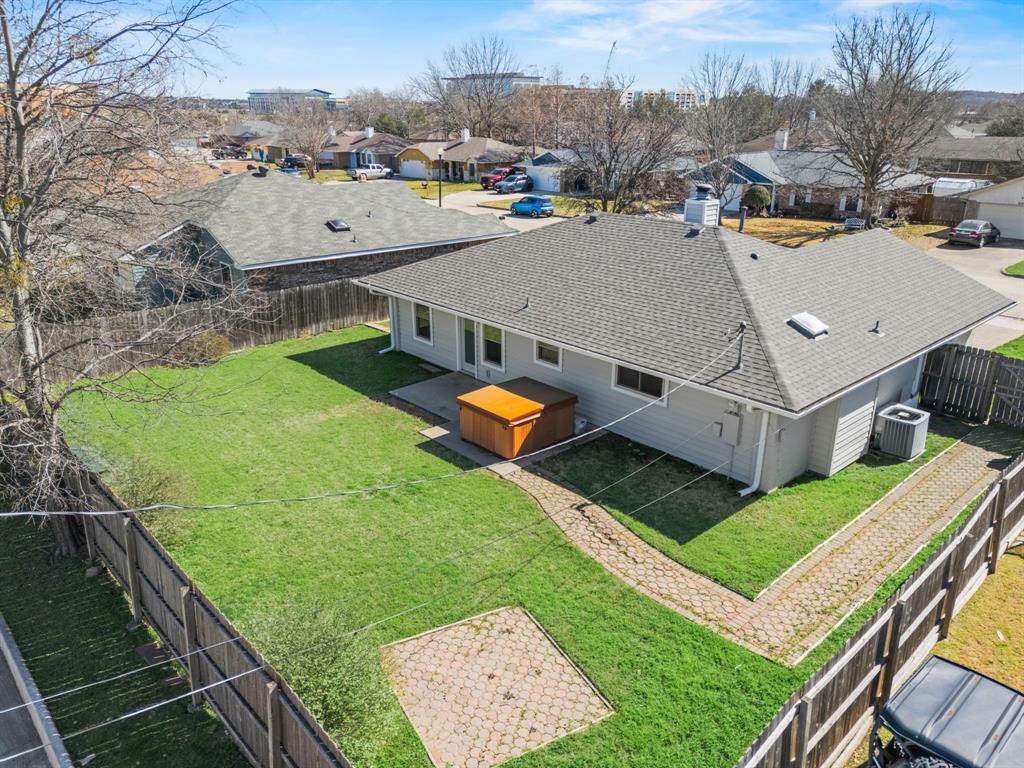 617 Reed Street Roanoke, TX 76262 - Photo 26 of 35 a view of a house with a backyard and a garden