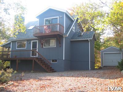 2303 Sage Rd Mount Long Pond, PA 18334 - Photo 1 of 15 a view of a house with a yard