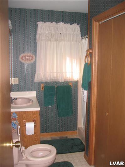 2303 Sage Rd Mount Long Pond, PA 18334 - Photo 7 of 15 a bathroom with a toilet a sink and shower