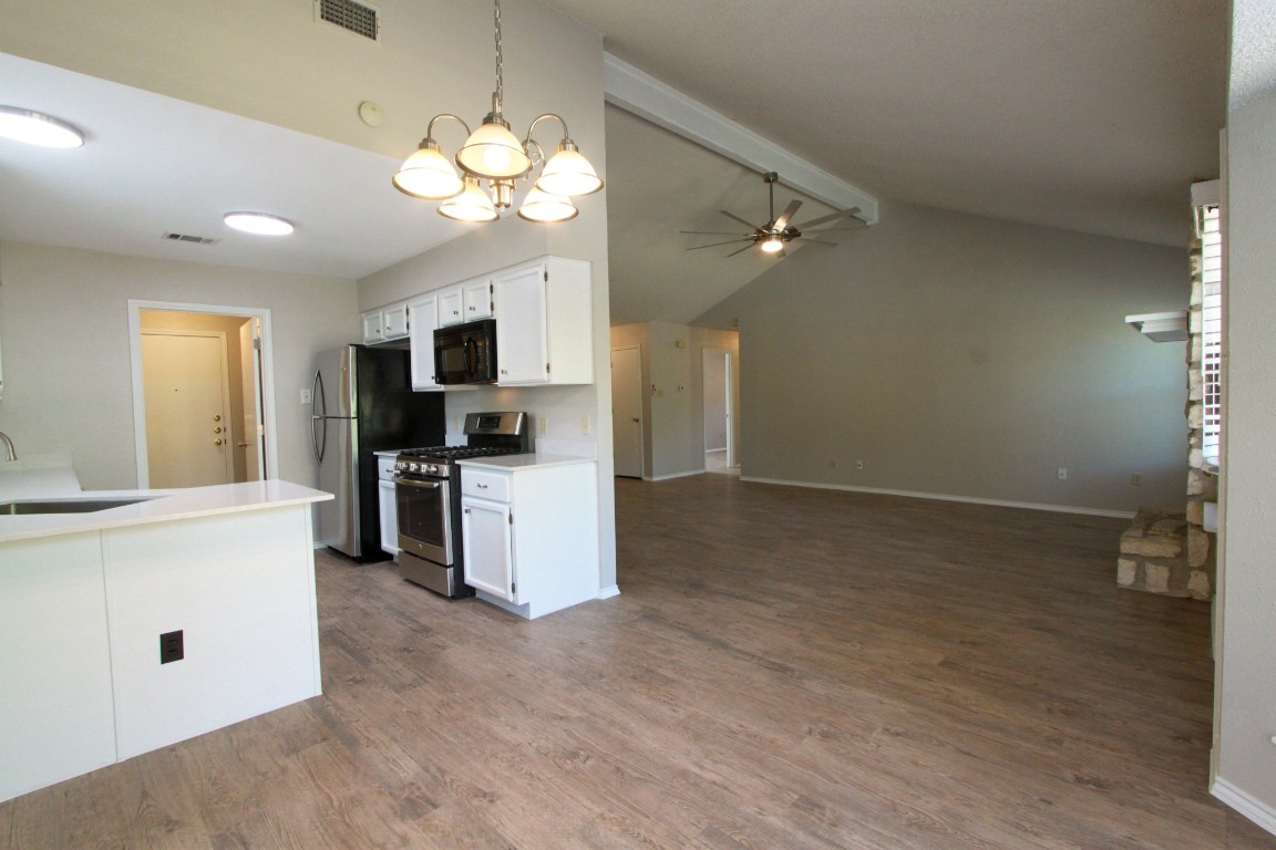 605 Timber Trail Cedar Park, TX 78613 - Photo 11 of 36 a view of kitchen with sink microwave and stove