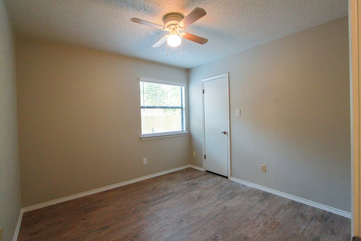 605 Timber Trail Cedar Park, TX 78613 - Photo 25 of 36 an empty room with a window and a fan