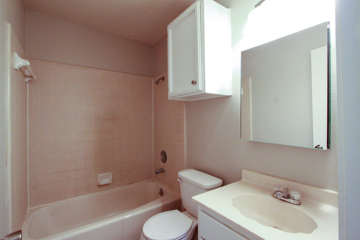 605 Timber Trail Cedar Park, TX 78613 - Photo 30 of 36 a bathroom with a sink toilet and shower