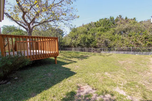 a view of a deck with a yard