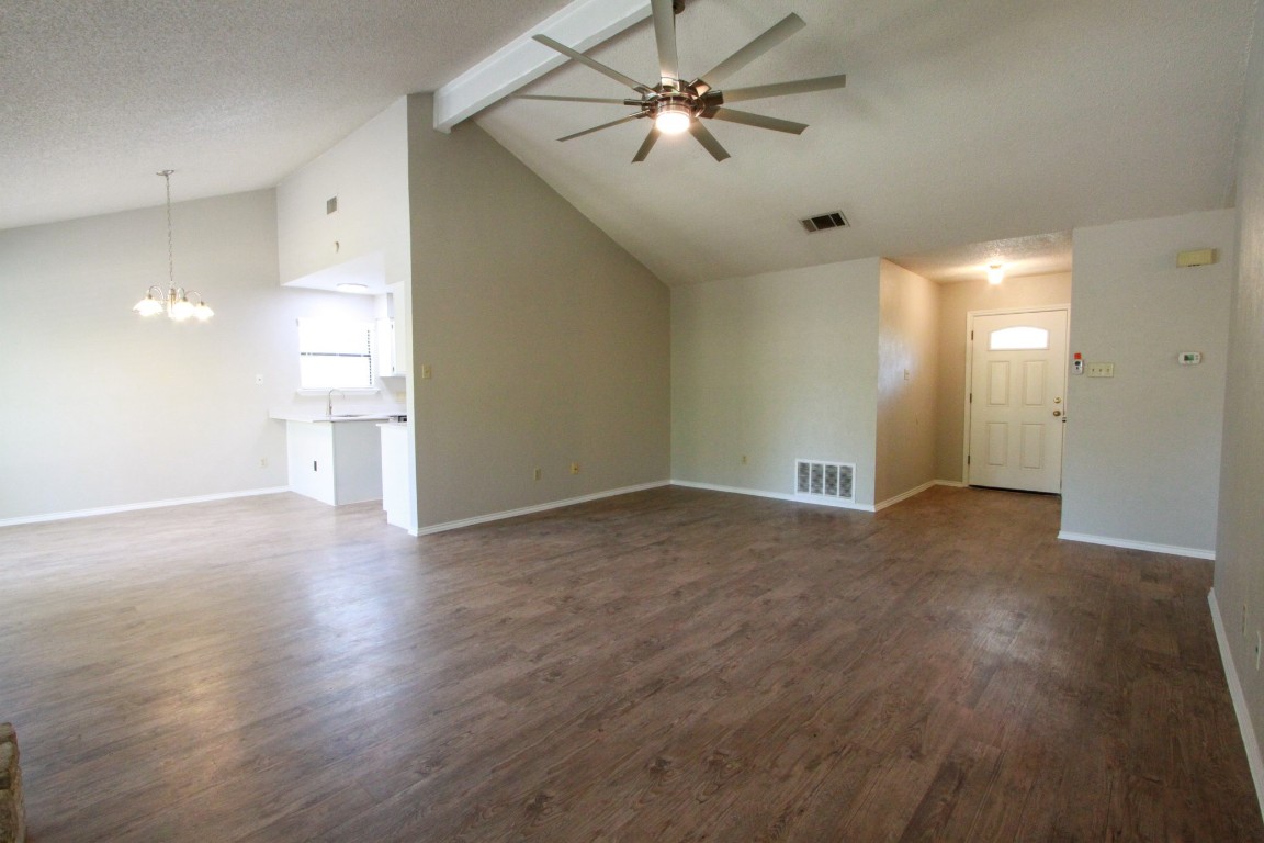 605 Timber Trail Cedar Park, TX 78613 - Photo 7 of 36 a view of empty room with wooden floor and fan