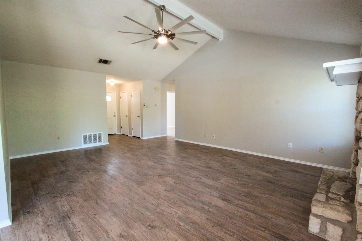 605 Timber Trail Cedar Park, TX 78613 - Photo 8 of 36 an empty room with wooden floor and fan