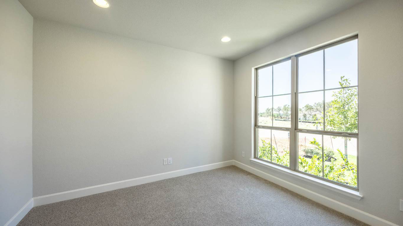 213 Adali Avenue Georgetown, TX 78633 - Photo 11 of 16 Carpeted spare room featuring baseboards and recessed lighting