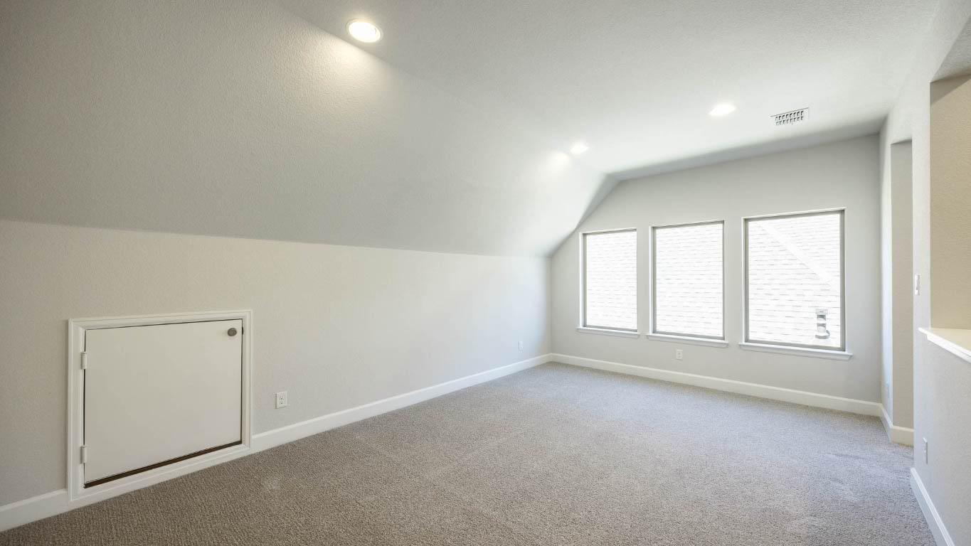 213 Adali Avenue Georgetown, TX 78633 - Photo 12 of 16 Additional living space with light colored carpet, vaulted ceiling, and recessed lighting