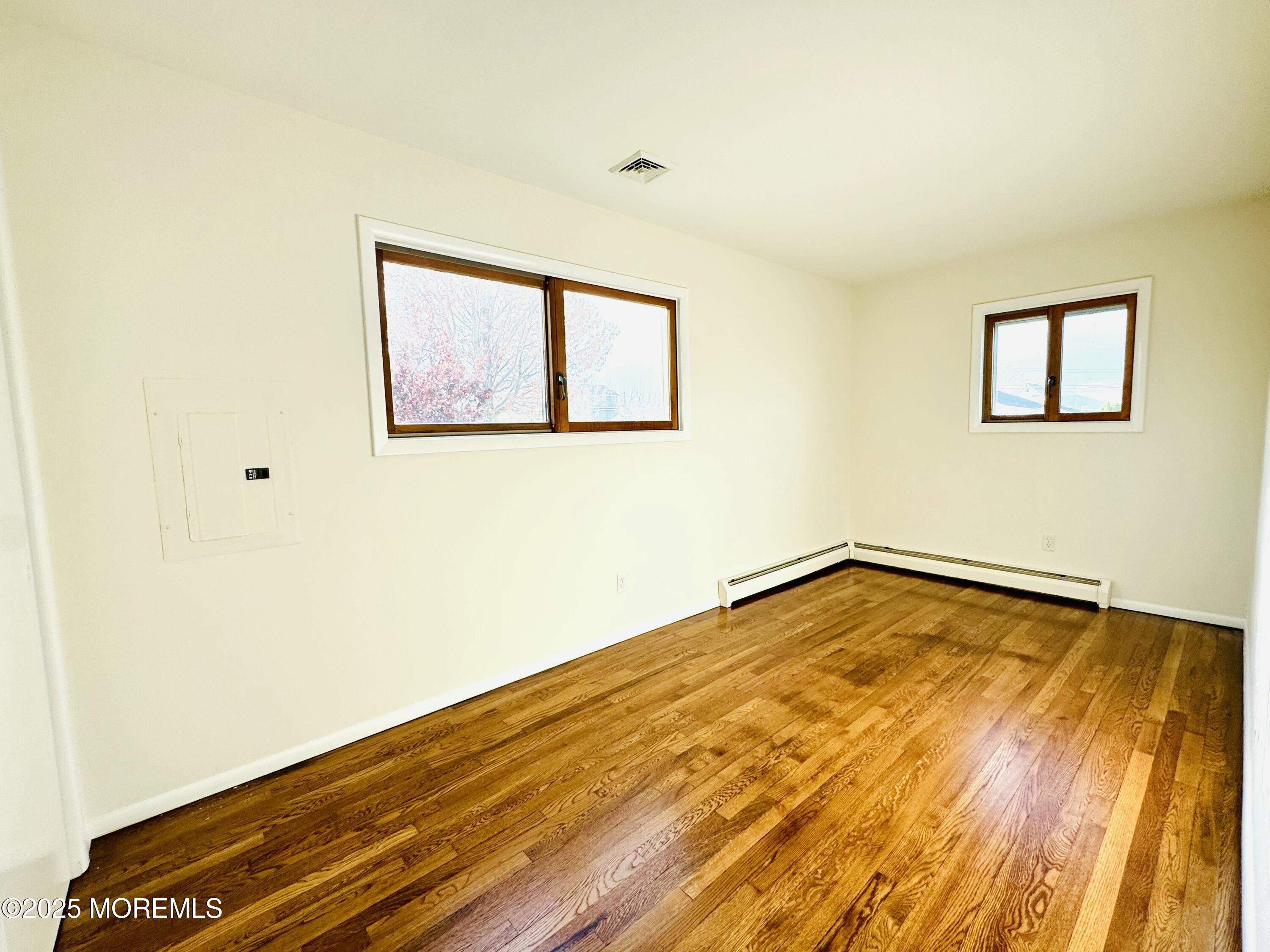 922 Capstan Drive Forked River, NJ 08731 - Photo 12 of 26 a view of a room with wooden floor and a window