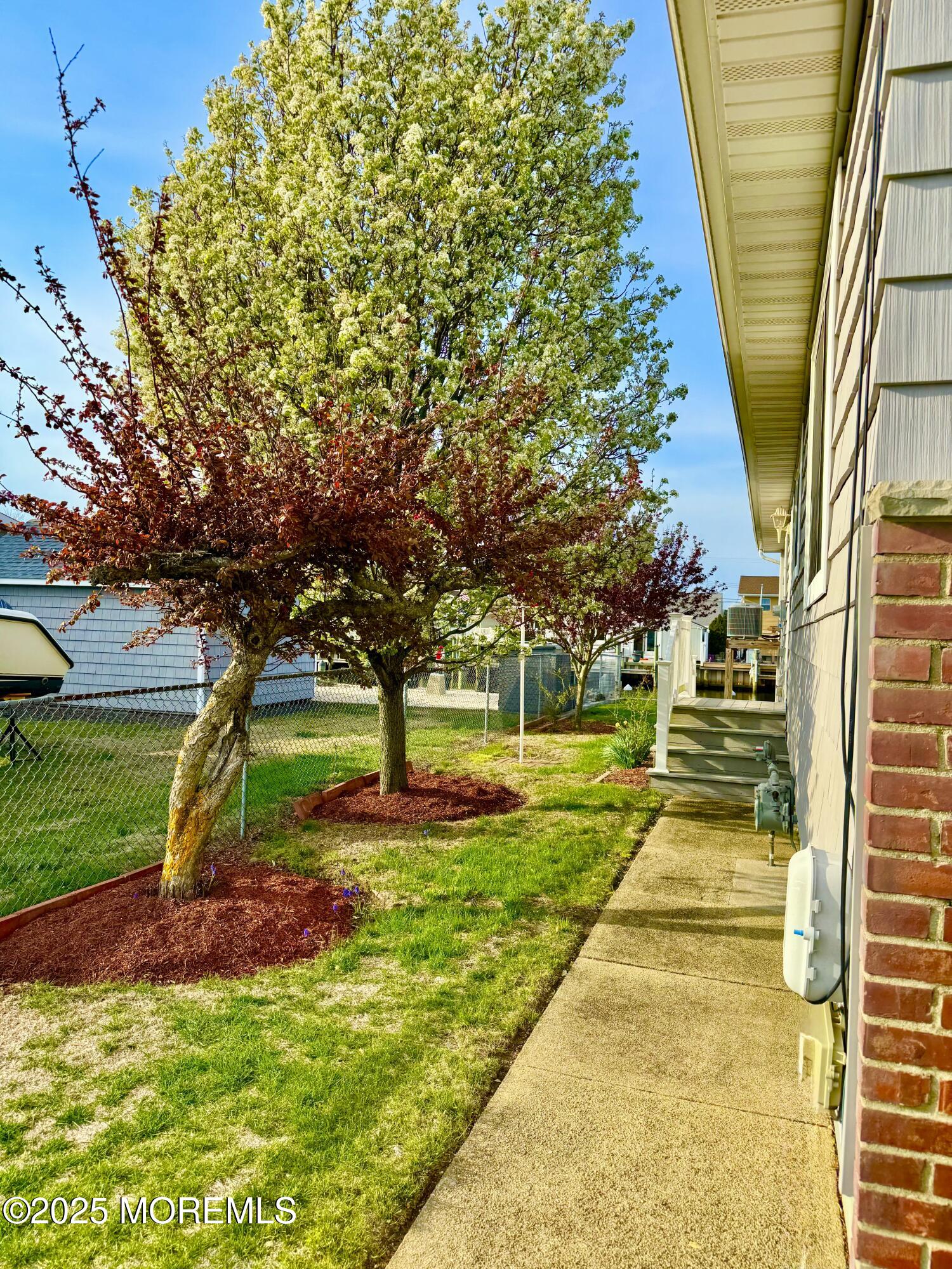 922 Capstan Drive Forked River, NJ 08731 - Photo 16 of 26 a view of swimming pool with a garden
