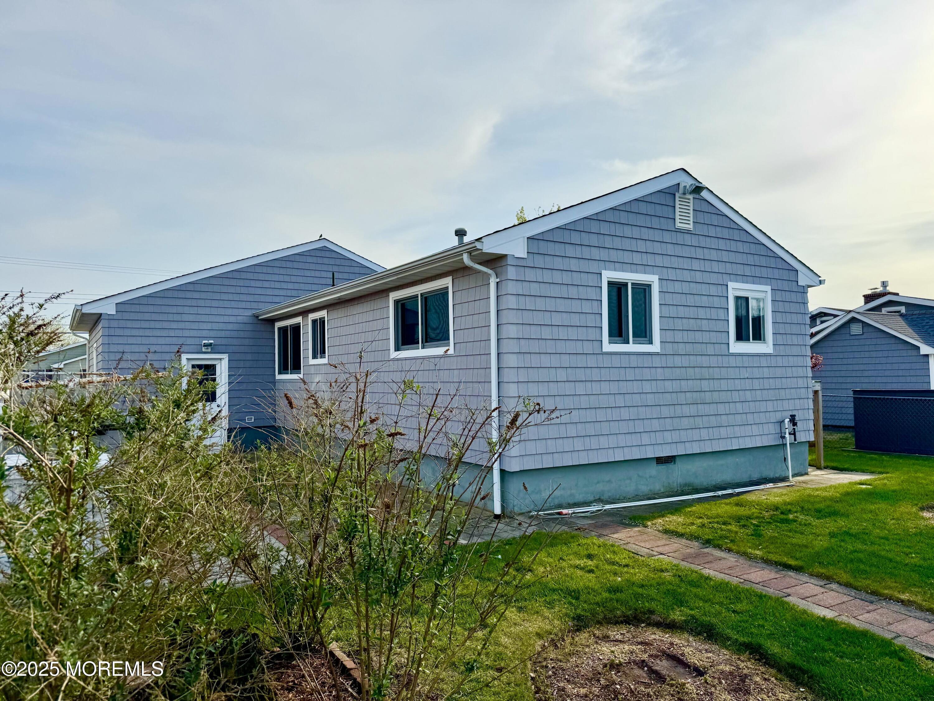 922 Capstan Drive Forked River, NJ 08731 - Photo 19 of 26 front view of a house with a yard
