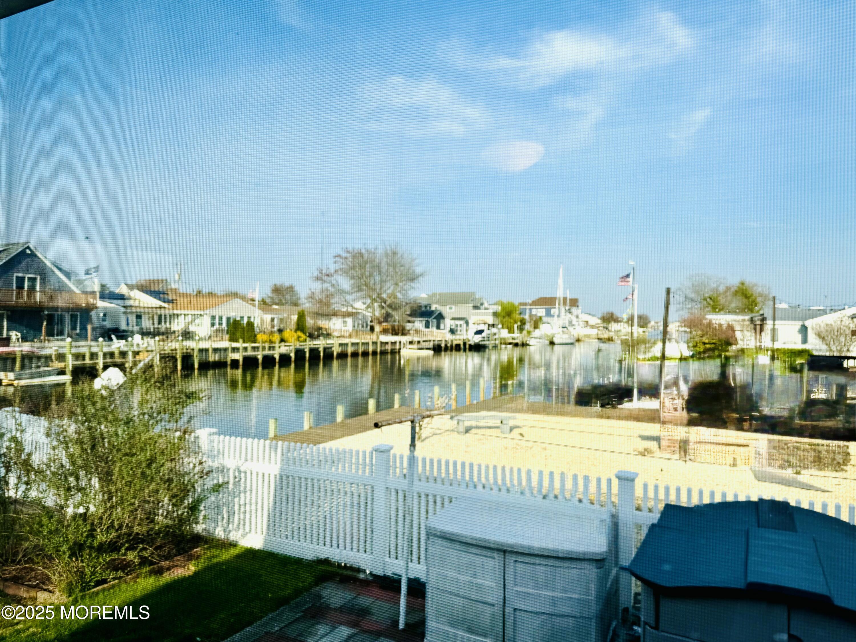 922 Capstan Drive Forked River, NJ 08731 - Photo 20 of 26 a view of a lake with a patio