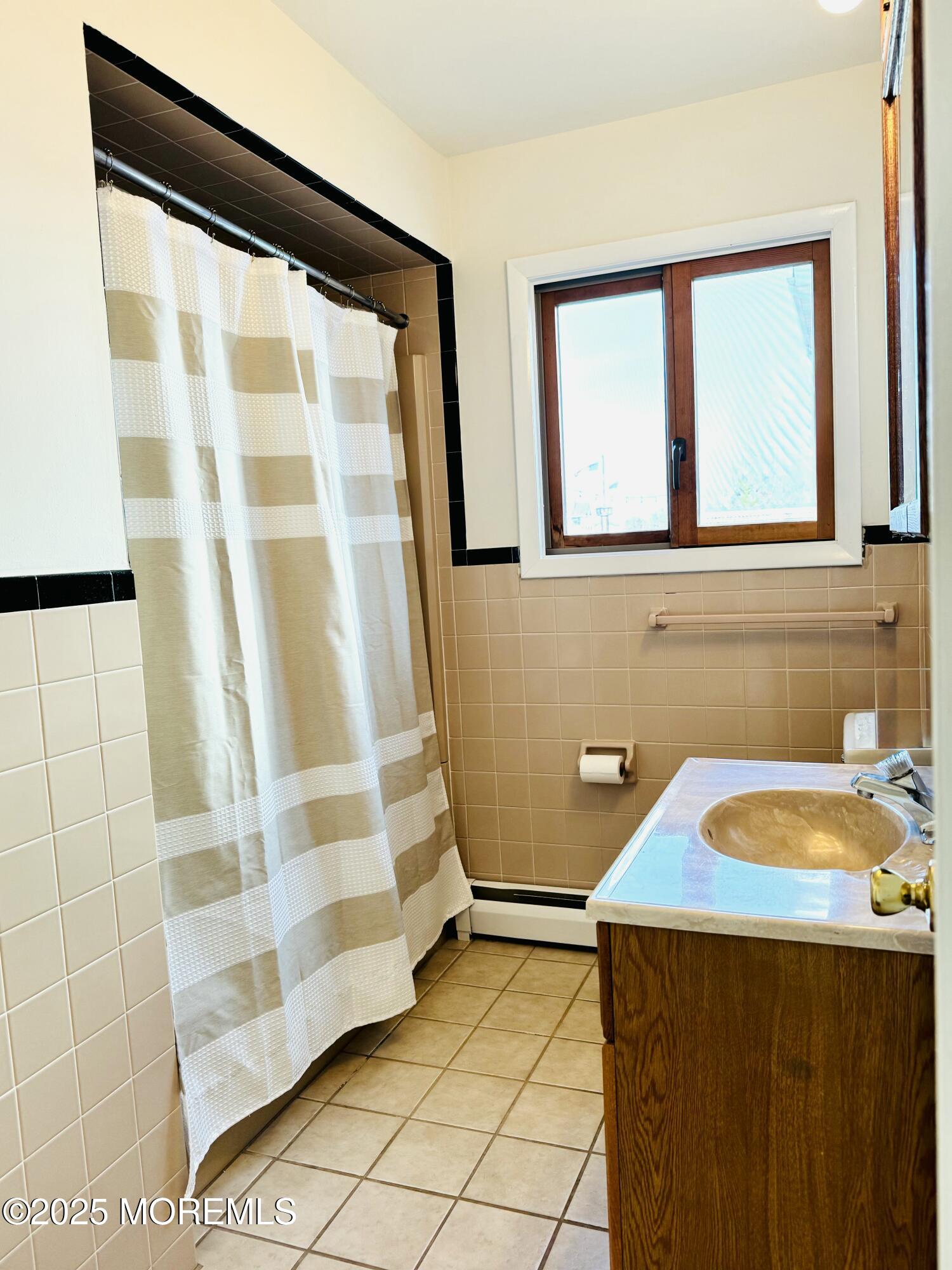 922 Capstan Drive Forked River, NJ 08731 - Photo 9 of 26 a bathroom with a sink and a shower