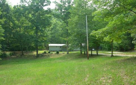 426 Garrett Branch Road Ellijay, GA 30536 - Photo 1 of 1 a view of green field with sitting area