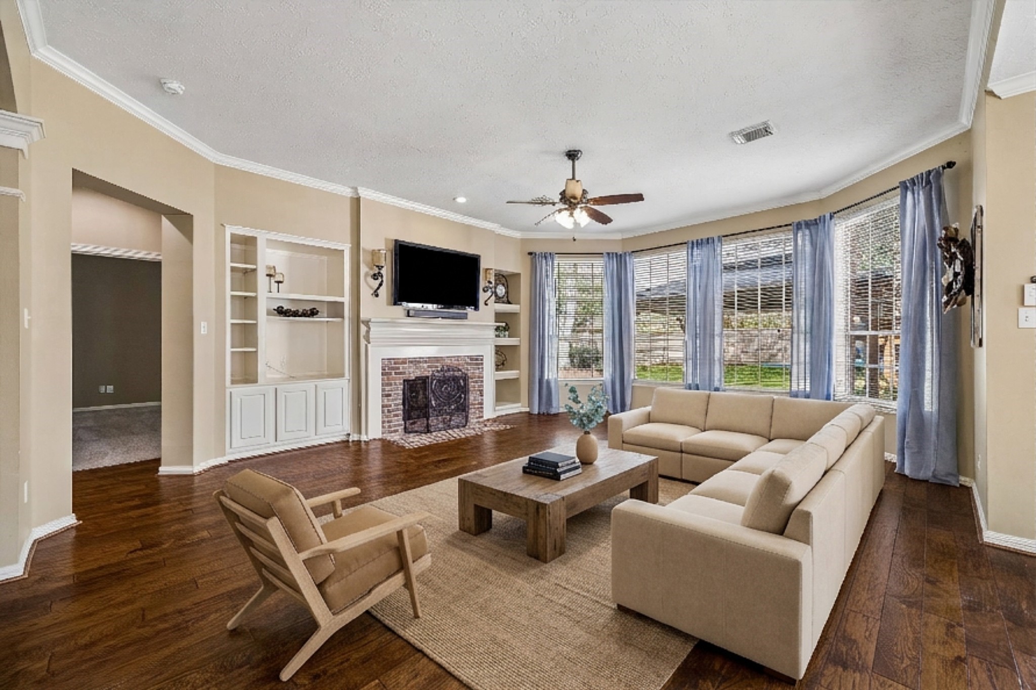 5310 Summerland Ridge Court Houston, TX 77041 - Photo 17 of 46 a living room with furniture fireplace and a flat screen tv