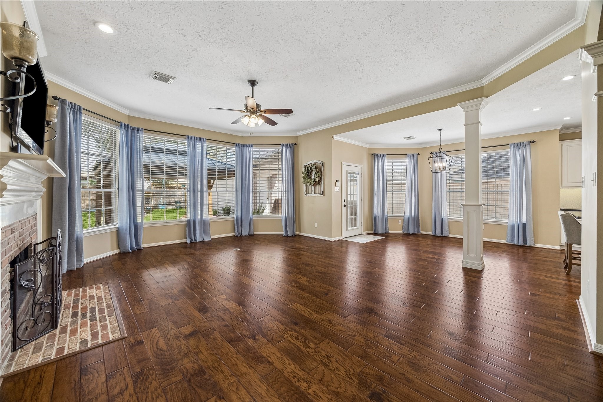 5310 Summerland Ridge Court Houston, TX 77041 - Photo 18 of 46 a view of an empty room with window and wooden floor